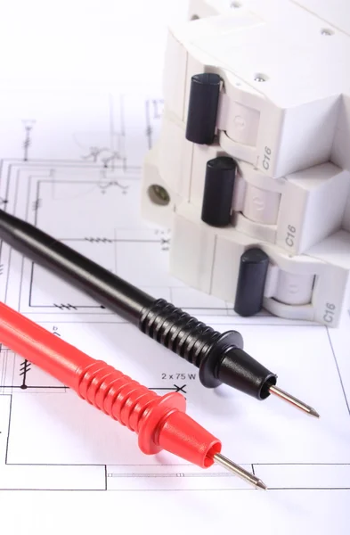 Cables of multimeter and electric fuse on construction drawing — Stock Photo, Image