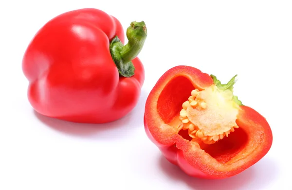 Whole and half of fresh peppers on white background — Stock Photo, Image