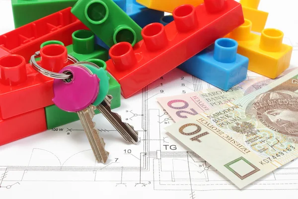 Home keys, colorful building blocks and money on housing plan — Stock Photo, Image