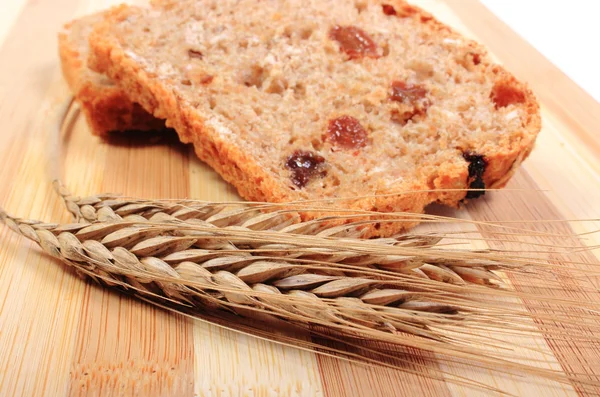 Fresh baked bread and ears of wheat — Stock Photo, Image