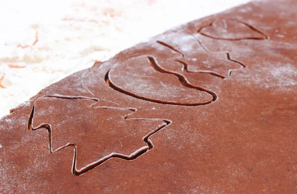 Shape of cookie cutters and dough for gingerbread — Stock Photo, Image