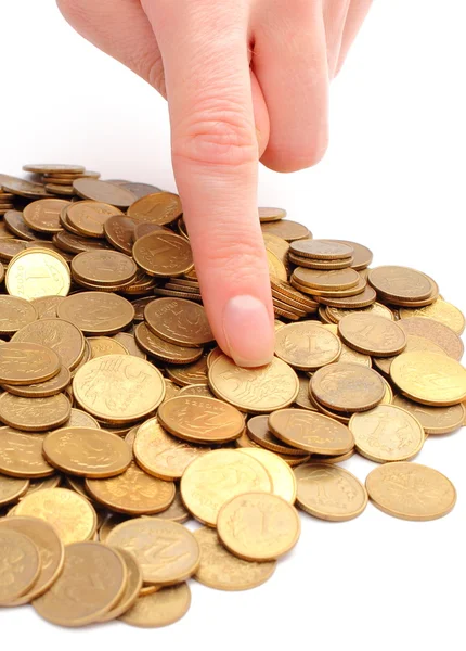 Heap of old coins and finger of woman — Stock Photo, Image