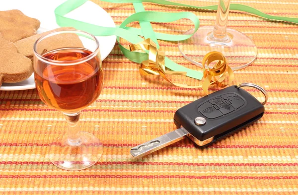 Car key with glass of wine on table after party — Stock Photo, Image