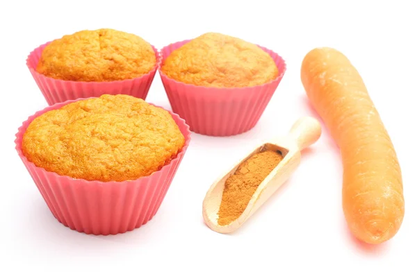 Fresh baked muffins with carrot and powdery cinnamon — Stock Photo, Image