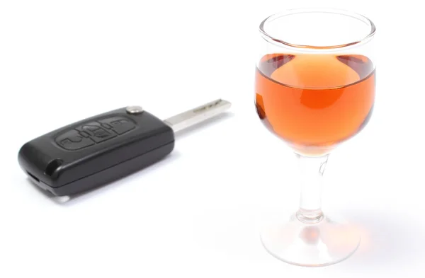 Car key and glass of wine. White background — Stock Photo, Image