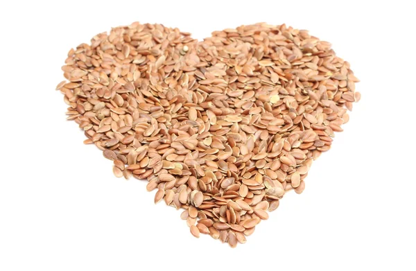 Valentine heart of linseed on white background — Stock Photo, Image