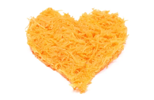 Heart shaped grated carrots on white background — Stock Photo, Image