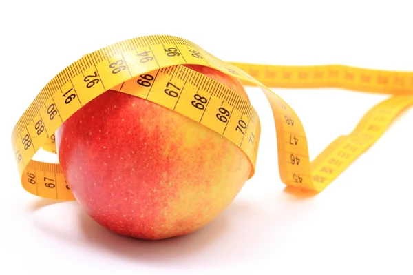 Fresh apple and tape measure on white background Stock Photo