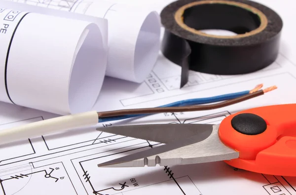 Accessories for engineer jobs and rolls of diagrams on construction drawing — Stock Photo, Image