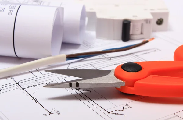 Accessories for engineer jobs and rolls of diagrams on construction drawing — Stock Photo, Image