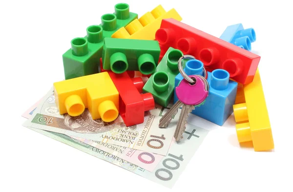 Bunte Bausteine für Kinder mit Hausschlüssel und Geld — Stockfoto