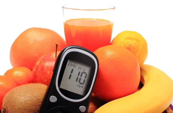 Glucometer, fresh natural fruits and glass of juice — Stock Photo, Image