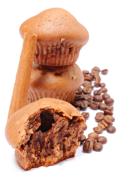 Fresh baked muffins, coffee grains and cinnamon — Stock Photo, Image