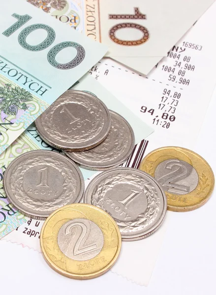 Money and coins with receipt on white background — Stock Photo, Image