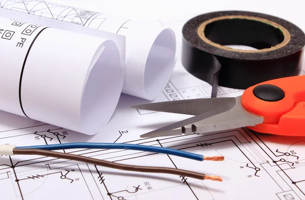 Accessories for engineer jobs and rolls of diagrams on construction drawing — Stock Photo, Image