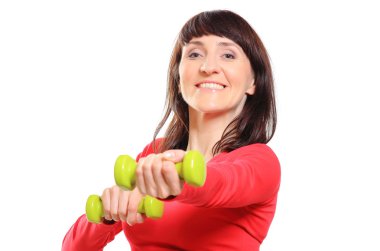 Güzel esmer dumbbells ile fitness egzersiz sırasında