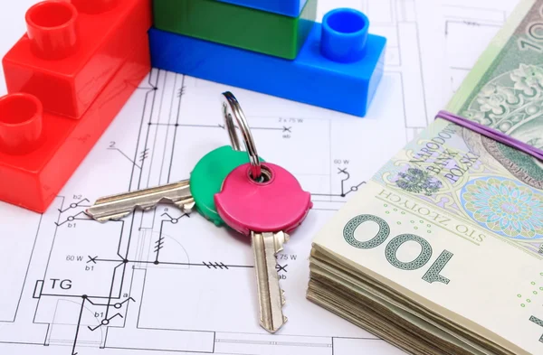 Heap of banknotes, keys and building blocks on drawing of house — Stock Photo, Image