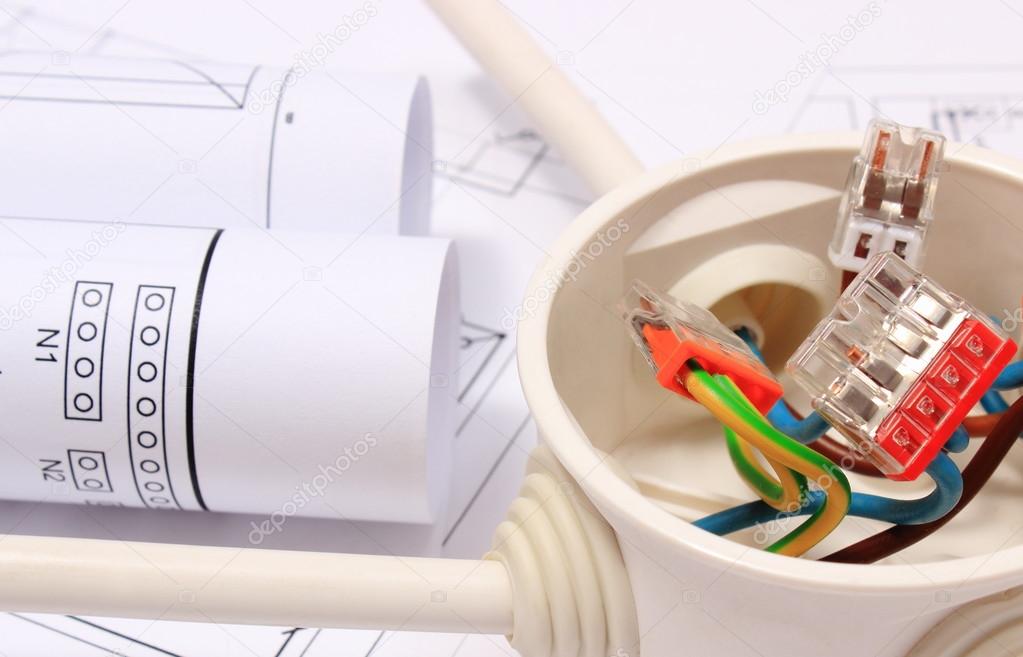 Electrical box with cables and diagrams on construction drawing