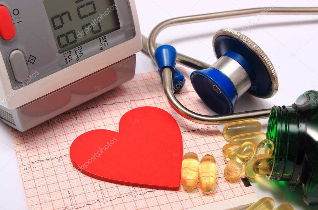 Heart shape on electrocardiogram, blood pressure monitor, stethoscope