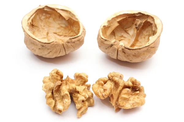 Walnut without shell and nutshells on white background — Stock Photo, Image