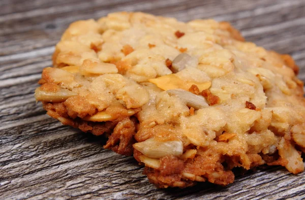 Oatmeal cookies on wooden background — Stock Photo, Image