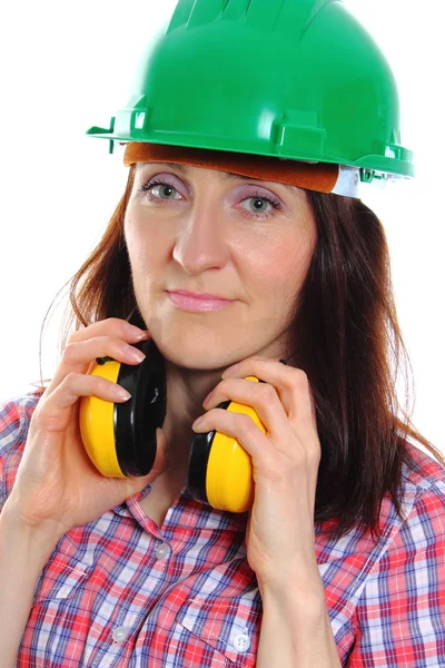 Woman wearing protective helmet and headphones — Stock Photo, Image