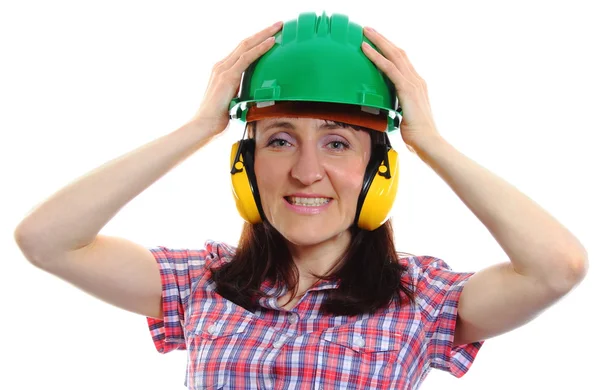 Woman wearing protective helmet and headphones — Stock Photo, Image