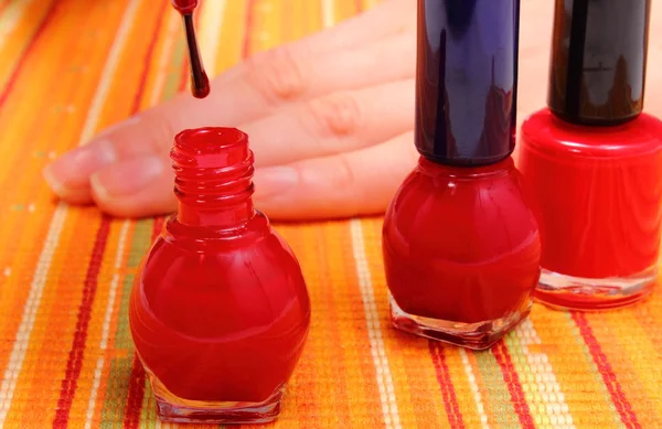 Applying red nail polish, manicured nails of woman — Stock Photo, Image