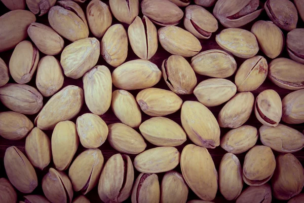 Vintage photo, Pistachio nuts as background, healthy eating — Zdjęcie stockowe