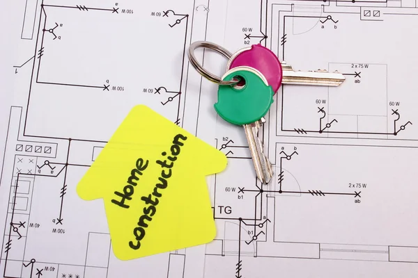 Casa de papel amarillo con texto casa construcción y llaves, dibujo de construcción — Foto de Stock