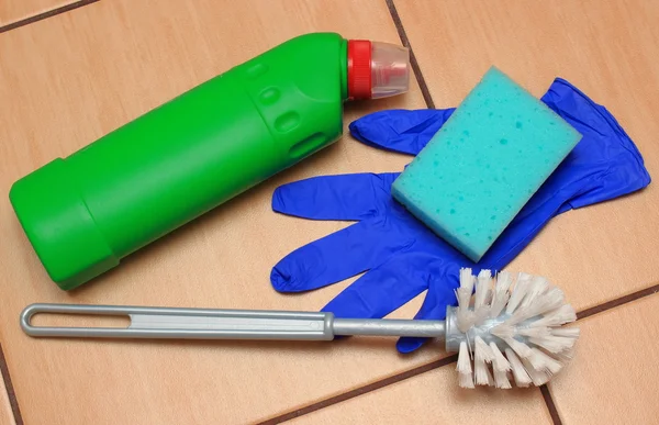 Accessories for cleaning bathroom on ceramics flooring — Stock Photo, Image