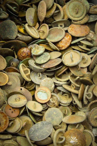 Heap of old rusty buttons for sale at the bazaar — Stock Photo, Image