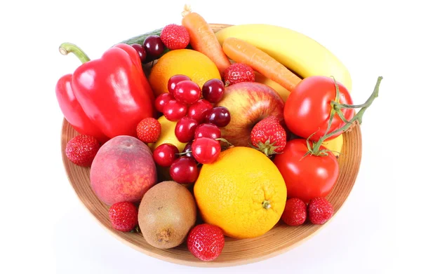 Fresh fruits and vegetables on wooden plate — Stock Photo, Image