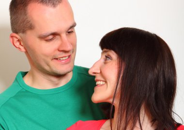 Smiling couple looking into each others eyes