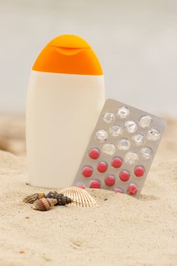 Shells, lotion and pills of vitamin A, seasonal concept