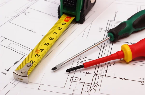 Work tools on electrical construction drawing of house — Stockfoto