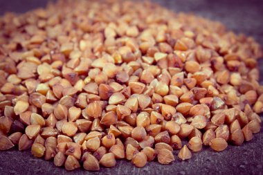 Vintage photo, Heap of buckwheat groats on cement structure
