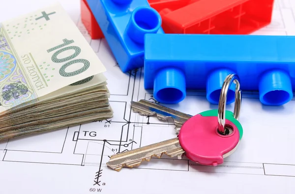 Heap of banknotes, keys and building blocks on drawing of house — Stock Photo, Image