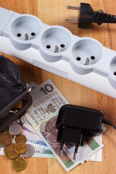 Electrical power strip with disconnected plugs and polish currency money, energy costs — Stock Photo, Image