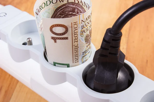 Electrical power extension with connected plug and polish currency money, energy costs — Stock Photo, Image
