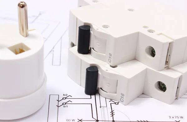 Electric plug and fuse on construction drawing of house — Stock Photo, Image