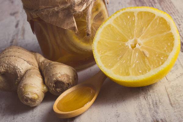 Vintage photo, Fresh lemon, honey and ginger on wooden table, healthy nutrition
