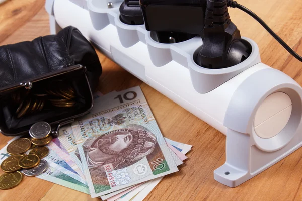 Electrical power strip with connected plugs and polish currency money, energy costs — Zdjęcie stockowe