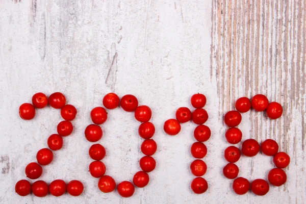 Happy new year 2016 made of red viburnum on old wooden background — Stock Photo, Image