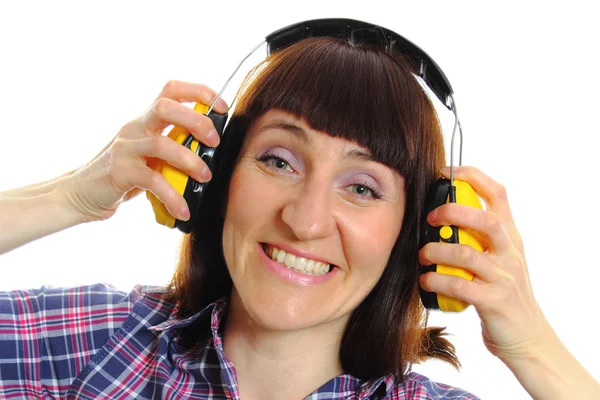 Budowniczy kobieta sobie słuchawki ochronne — Zdjęcie stockowe