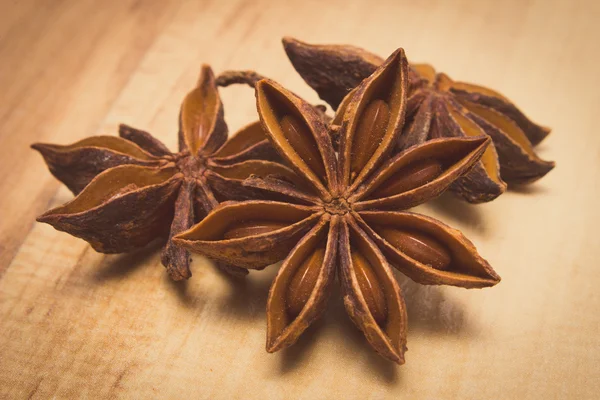 Vintage photo, Star of anise on wooden table, seasoning for cooking — Stok fotoğraf