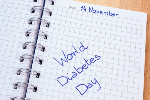 Wereld diabetes dag geschreven in notebook — Stockfoto