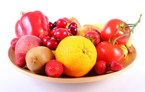 Fresh fruits and vegetables on wooden plate — Stock Photo, Image