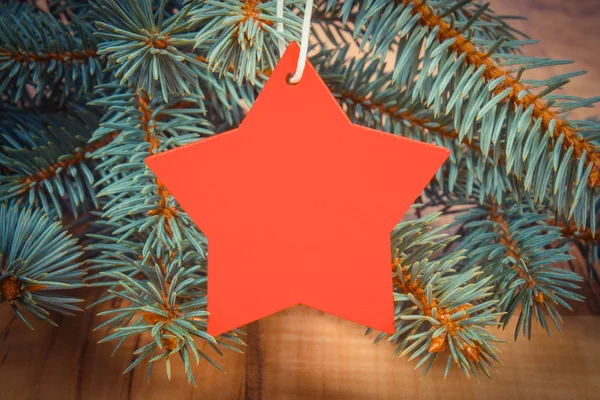 Vintage photo, Spruce branches and red wooden star with copy space for text — Stockfoto