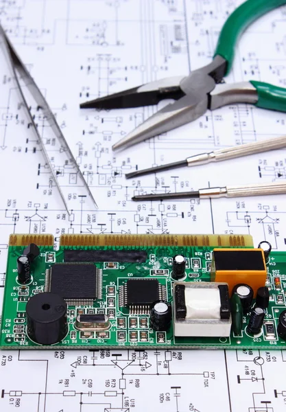 Printed circuit board and precision tools on diagram of electronics, technology — Stock Photo, Image